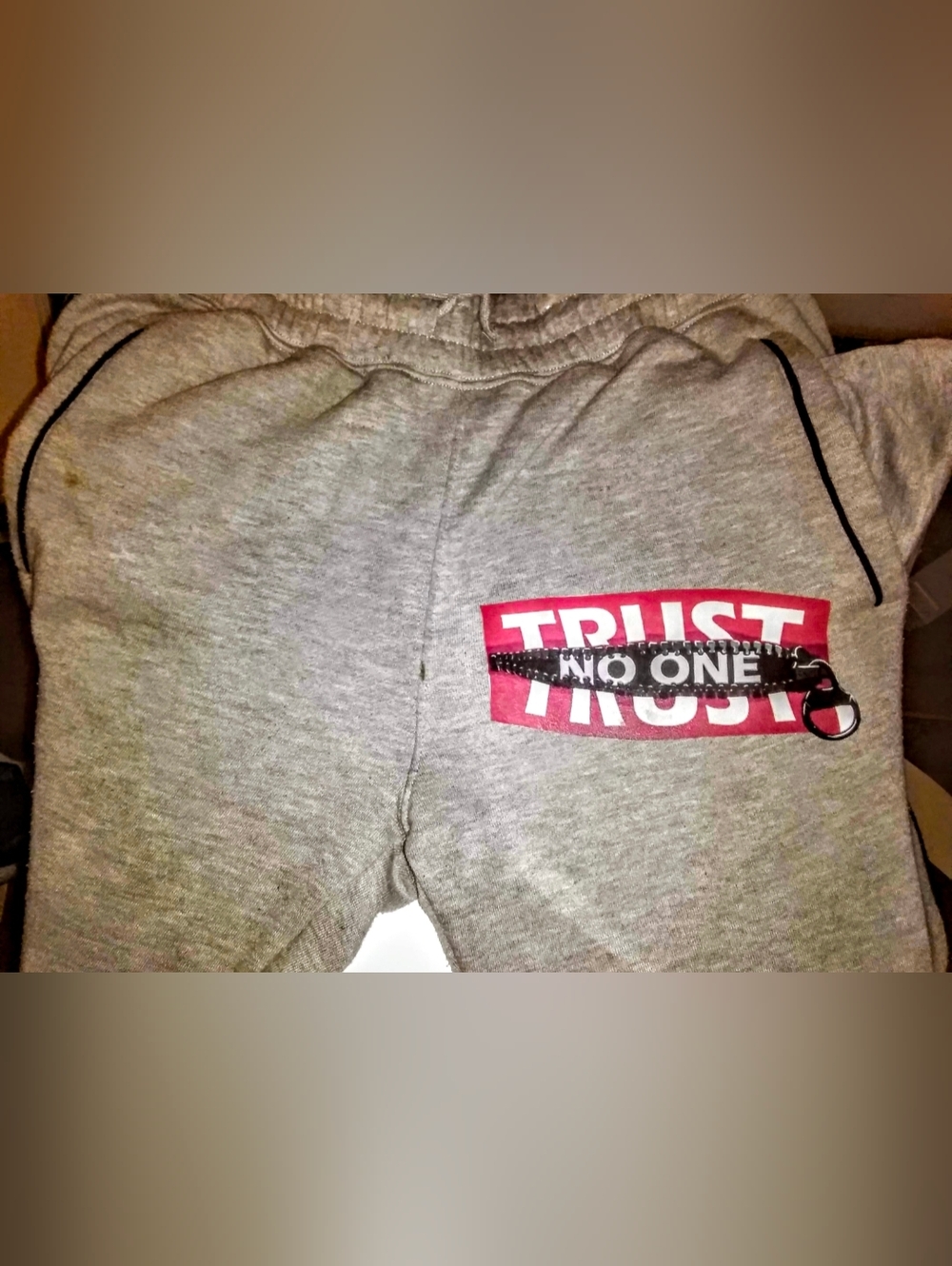 Gray Graphic Sweat Pants with Red 'Trust No One' Detail